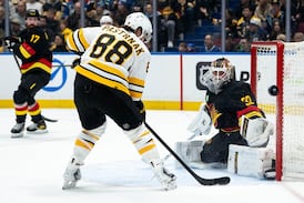 Minten scores in overtime, Boston Bruins top Vancouver Canucks 3-2