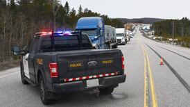 More than a dozen people charged with driving on a closed Hwy. 11