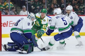 Canucks lose 5-2 as Wild wrap up a playoff spot