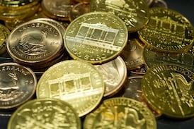 Gold declines on stronger U.S. dollar in thin trading